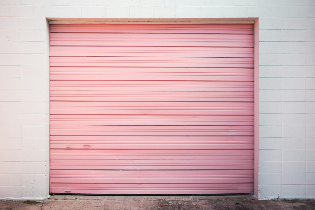 Pink-colored garage door hinges.