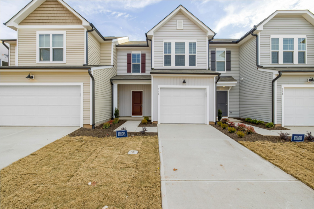 multiple houses with white garage doors