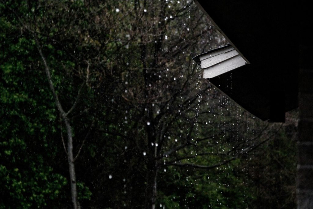 rainwater dropping from a roof