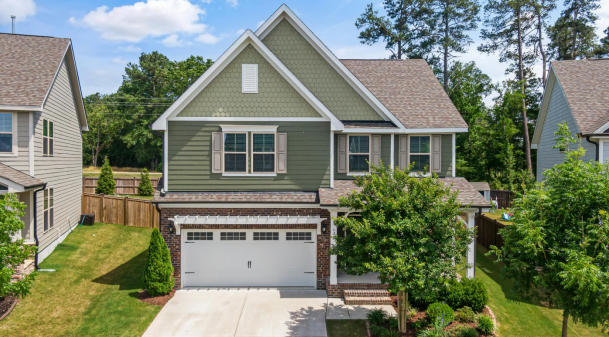 house with a windowed garage door